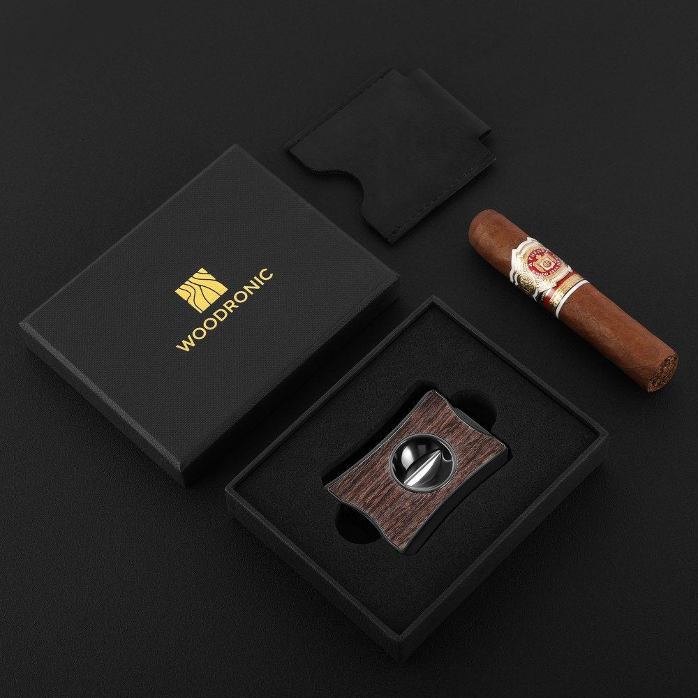 Woodronic branded premium gift box containing wenge wood dual cigar cutter, matching black leather travel pouch, paired with a luxury cigar for gifting to cigar lovers.