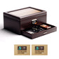 Closed ebony wood cigar humidor with glass lid, digital hygrometer, and pull-out accessory drawer, perfect for desktop display.
