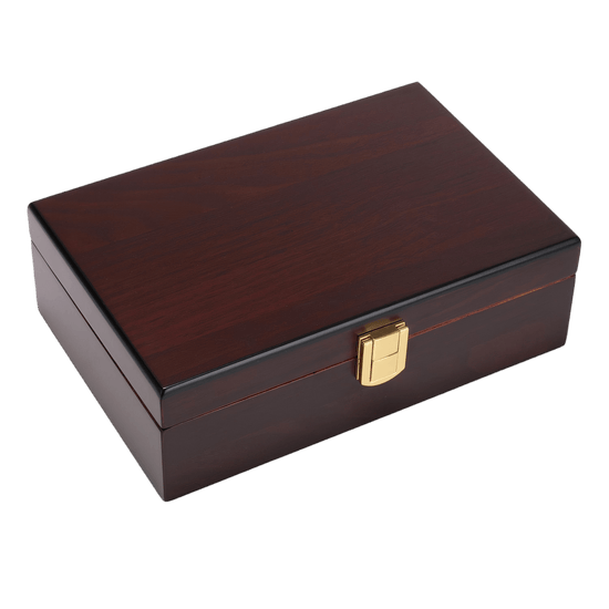 A closed, rectangular wooden cigar humidor with a glossy dark reddish-brown finish, featuring a gold-colored metal clasp at the front center.