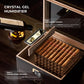 An instructional graphic demonstrating the crystal gel humidifier system: Step 1 (adding humidor solution) and Step 2 (maintaining 65%-75% stable humidity), with cigars in the humidor.