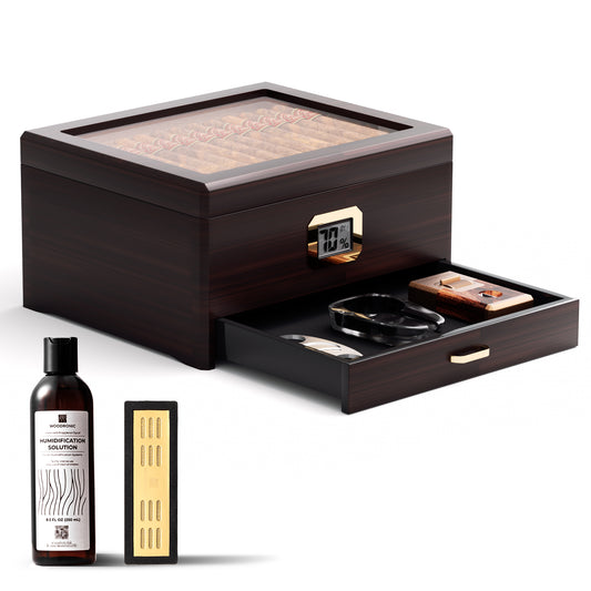 A dark wooden cigar humidor with a glass top, digital hygrometer, and pull-out accessory drawer, displayed with its full set: humidification solution, crystal gel humidifier, ashtray, cutter, and lighter, against a white background.