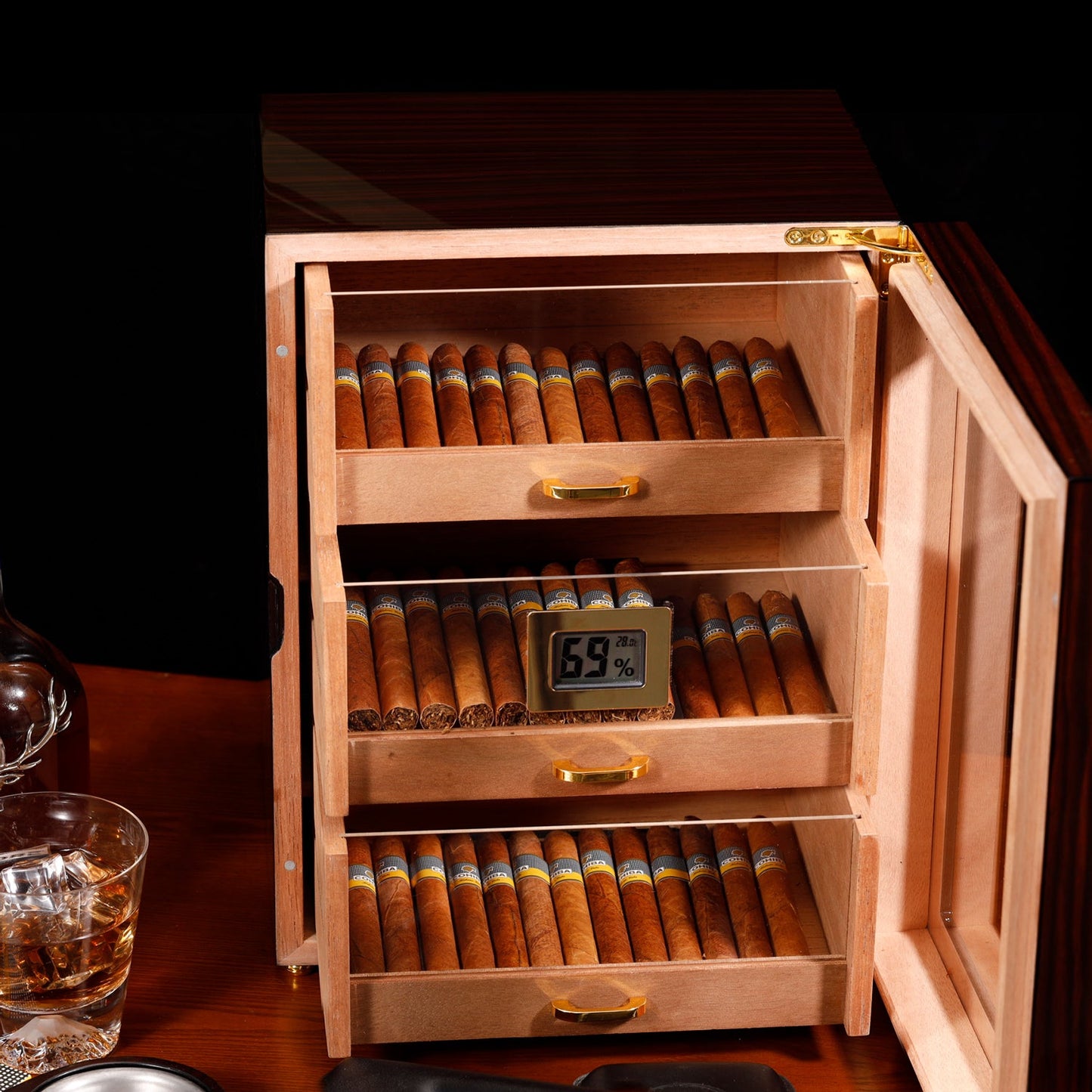 Open 3-drawer humidor showing organized cigar storage, digital hygrometer, and Spanish cedar interior.