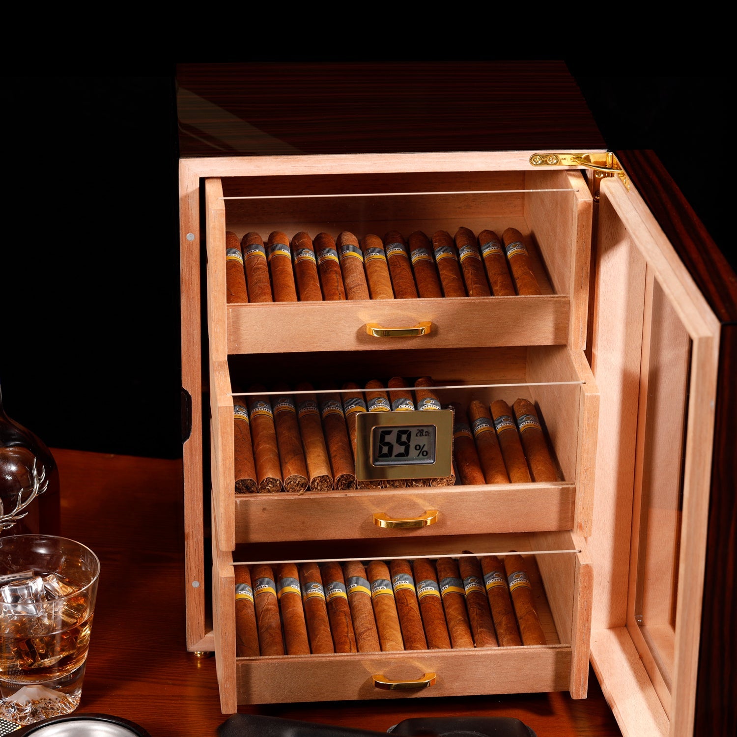 Open 3-drawer humidor showing organized cigar storage, digital hygrometer, and Spanish cedar interior.