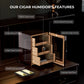 Infographic of key features: glossy ebony finish, digital hygrometer, Spanish cedar lining, shock-absorbing hinges, and large drawers.