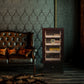 Ebony wood humidor placed beside a tufted leather sofa, ideal for elegant home decor and cigar enjoyment.