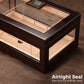 Cigar humidor with airtight non-porous seal and digital hygrometer, ensuring stable humidity levels for optimal cigar preservation.