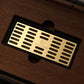 Close-up of branded gold humidity tray inside cigar humidor, designed for Boveda packs to maintain consistent humidity.