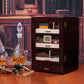 Ebony wood humidor displayed with whiskey decanter, cigar cutter, and ashtray, ideal for premium home bar decor and gifting.