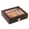 A closed dark wooden cigar humidor with a clear glass top, revealing neatly arranged cigars inside, featuring a gold-rimmed hygrometer on the front panel, set against a white background.