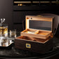 2-tiered wenge wood cigar humidor with LED lighting, displayed on a marble table with whiskey decanter, perfect for sophisticated home decor.