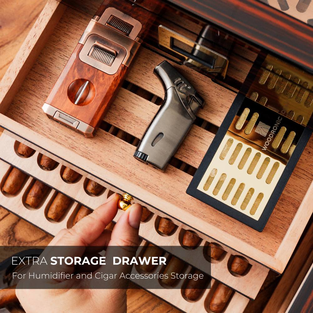 Extra storage drawer for cigar accessories (lighter, cutter, humidifier), demonstrating functional organization alongside cigar slots.