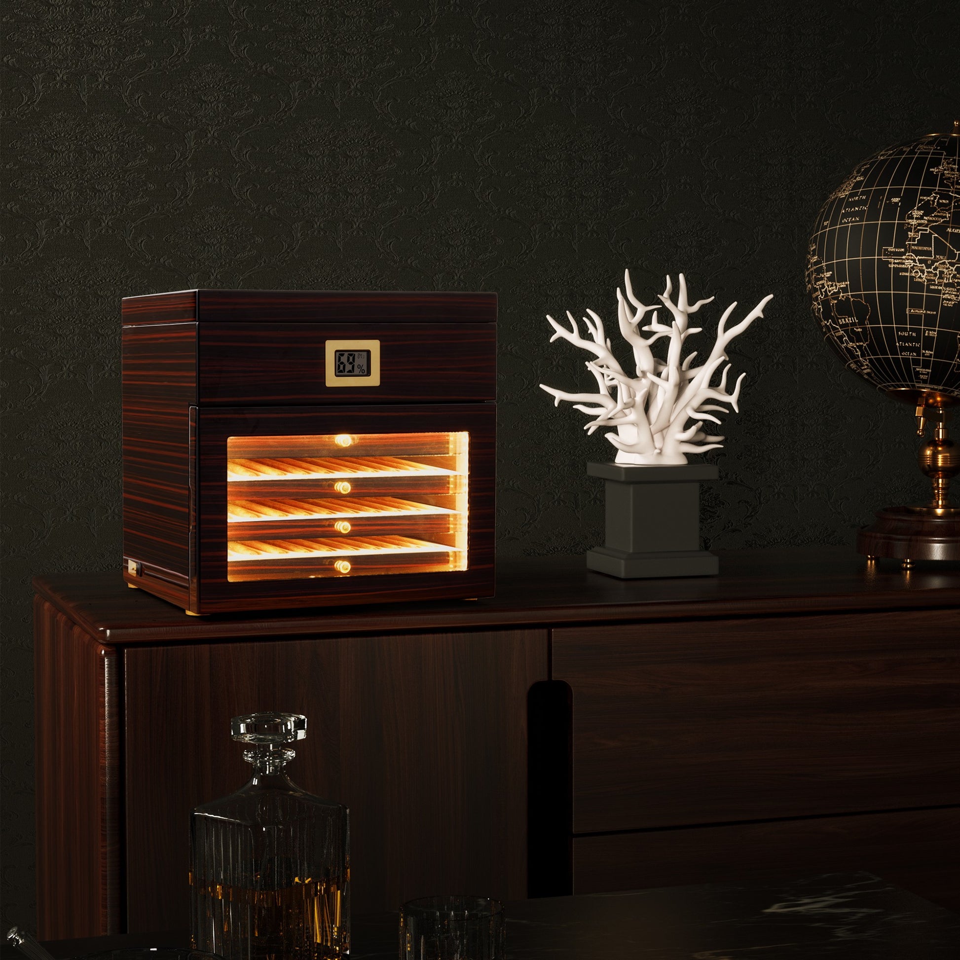 Tiered cigar humidor displayed on a dark wood cabinet in a sophisticated home office, paired with whiskey decor for elegant styling.