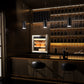 Stainless steel electric humidor integrated into a modern home bar, pairing with wine storage for elegant entertaining.
