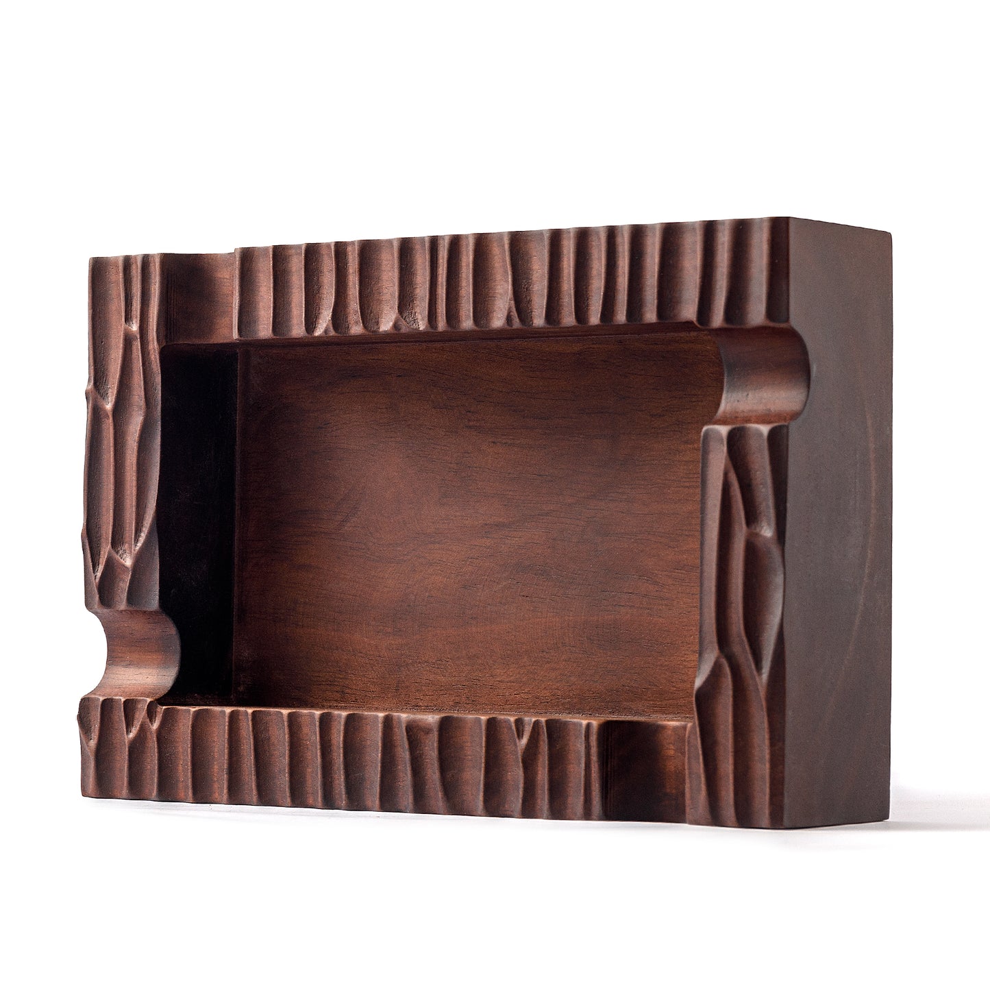 Side view of empty rectangular walnut ashtray, showcasing hand-carved edge details and deep bowl.