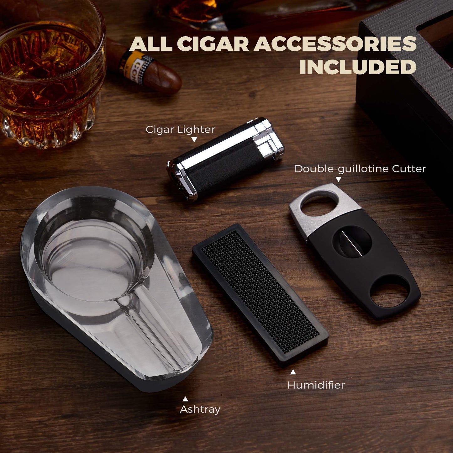 Complete set of cigar accessories: lighter, double-guillotine cutter, crystal ashtray, and foam humidifier, included with the humidor.