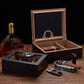Two humidors displayed with premium cigars and whiskey, ideal for elegant home bar decor and gifting.