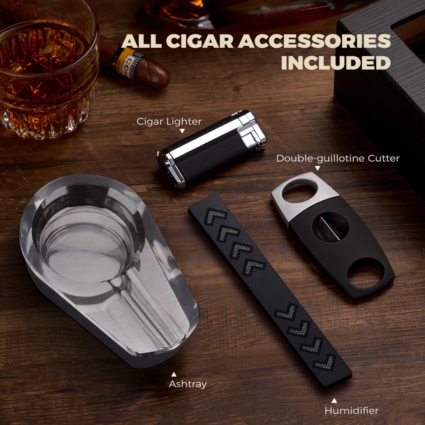 Complete set of cigar accessories: lighter, double-guillotine cutter, crystal ashtray, and foam humidifier, included with the humidor.
