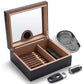 Open humidor with Spanish cedar interior, removable divider, and organized cigar storage, paired with included accessories.