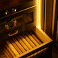 Warm LED lighting illuminates a drawer of premium cigars, highlighting the humidor’s elegant display and Spanish cedar interior.