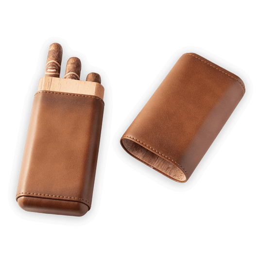 Brown leather cigar case with cedar wood inner liner, shown open holding three cigars and closed with its protective sleeve, portable travel storage for cigar enthusiasts.