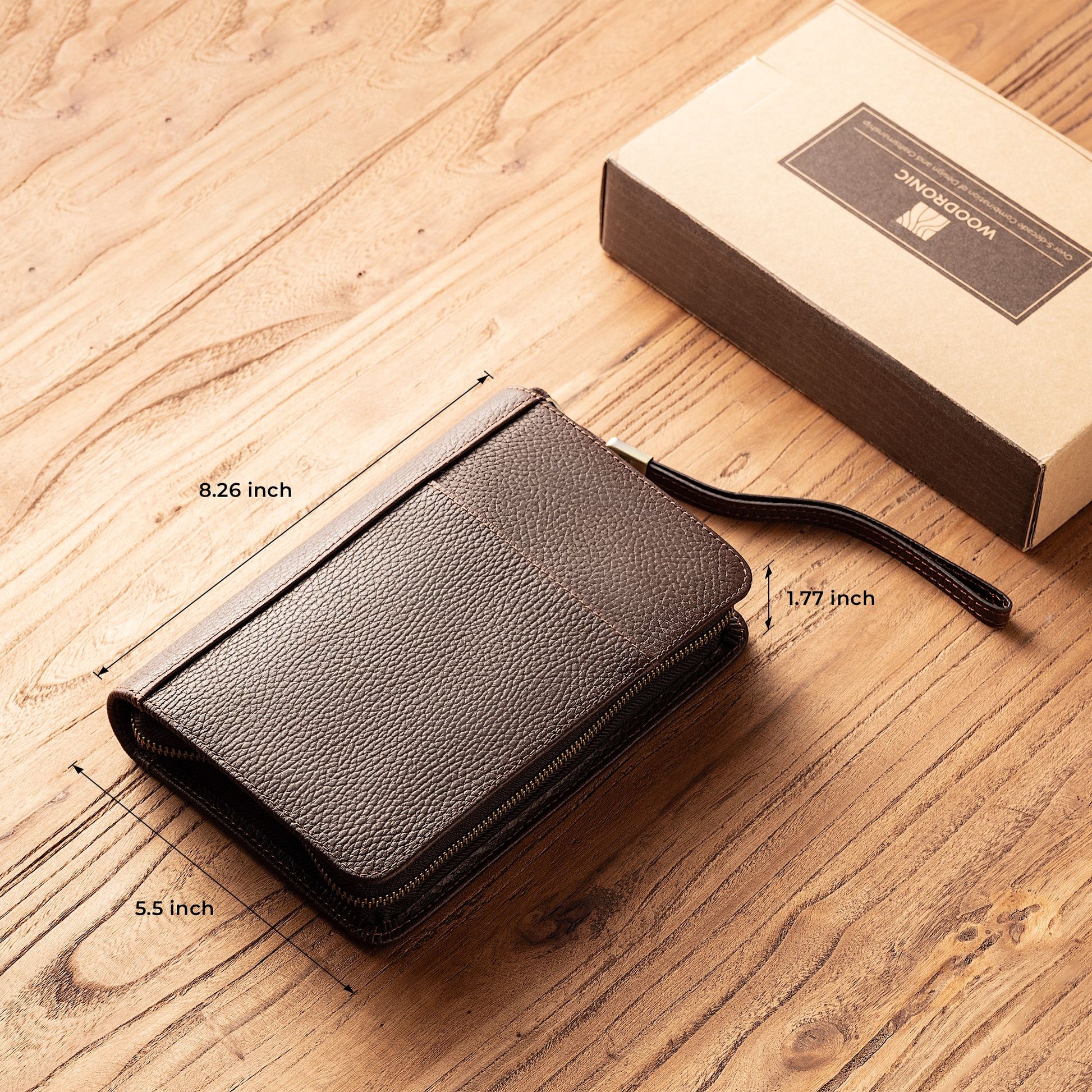 Woodronic branded leather cigar case with labeled dimensions (8.26" x 5.5" x 1.77"), displayed next to its kraft gift box on a wooden surface.